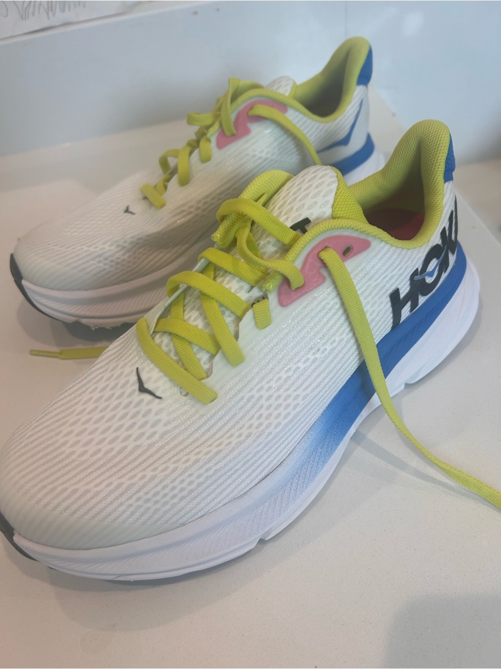 Hoka Kids White Sneakers with Blue and Yellow Accents